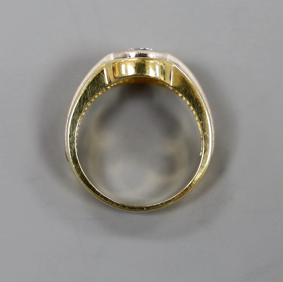 A modern 18ct two colour gold and solitaire diamond set ring, with sand blasted band, size L, gross weight 6.2 grams
